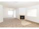 Spacious living room featuring a fireplace and sliding glass door leading to the patio at 2191 Bay Club Dr # 204, Laughlin, NV 89029