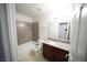 Well-lit bathroom featuring a shower-tub combo and granite vanity at 2606 S Durango Dr # 264, Las Vegas, NV 89117