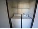 Convenient laundry closet with washer and dryer hookups and additional storage shelf at 2606 S Durango Dr # 264, Las Vegas, NV 89117
