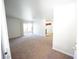 Spacious living room with carpet flooring and sliding door to the balcony at 2606 S Durango Dr # 264, Las Vegas, NV 89117