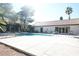 Community pool with lounge chairs and clear blue water for relaxing on a hot day at 2606 S Durango Dr # 264, Las Vegas, NV 89117