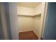 Functional walk-in closet featuring built-in shelving and carpeted floor at 2606 S Durango Dr # 264, Las Vegas, NV 89117