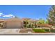 Daytime view of a single-story home with a two-car garage and well-maintained landscaping at 3 Chatmoss Rd, Henderson, NV 89052