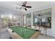 Bright game room featuring a pool table, bar seating, and natural light from large windows at 3 Chatmoss Rd, Henderson, NV 89052