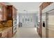 Gourmet kitchen and dining area featuring stainless appliances and designer finishes at 3 Chatmoss Rd, Henderson, NV 89052