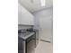 Laundry room with front load washer and dryer with white cabinets and tile flooring at 3 Chatmoss Rd, Henderson, NV 89052