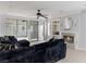 Bright living room featuring modern furniture, fireplace, and sliding glass doors to backyard at 3 Chatmoss Rd, Henderson, NV 89052