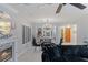 Bright living room featuring modern furniture, fireplace, and sliding glass doors to backyard at 3 Chatmoss Rd, Henderson, NV 89052