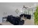 Well-lit living room with oversized sofas, tile floors, and decorative accents at 3 Chatmoss Rd, Henderson, NV 89052