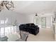 Bright living room featuring modern furniture, fireplace, and sliding glass doors to backyard at 3 Chatmoss Rd, Henderson, NV 89052