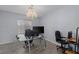 Home office with a glass desk, contemporary chandelier, and wood-look flooring at 3 Chatmoss Rd, Henderson, NV 89052