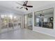 Sun room with ceiling fan and sliding glass doors to the outside patio at 3 Chatmoss Rd, Henderson, NV 89052
