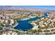 Picturesque aerial view of the lake, lush landscaping, and surrounding community at 3109 Siena Cir, Las Vegas, NV 89128