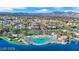 Breathtaking aerial view of the community beach and lake with mountain views in the background at 3109 Siena Cir, Las Vegas, NV 89128