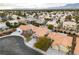 Stunning aerial view of a neighborhood featuring diverse home styles, well-manicured lawns, and a peaceful ambiance at 3109 Siena Cir, Las Vegas, NV 89128