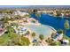 Stunning aerial view of the community lagoon with beach, tower and mature palm trees at 3109 Siena Cir, Las Vegas, NV 89128