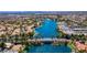 Beautiful aerial view of a community lake and bridge, surrounded by lush greenery and residences at 3109 Siena Cir, Las Vegas, NV 89128