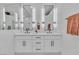 Modern bathroom features dual vanities, sleek mirrors, and contemporary fixtures at 3109 Siena Cir, Las Vegas, NV 89128