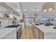 Modern kitchen features stainless appliances, a large island, and sleek countertops at 3109 Siena Cir, Las Vegas, NV 89128