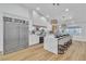 Bright kitchen featuring a large island, stainless steel appliances and modern pendant lighting at 3109 Siena Cir, Las Vegas, NV 89128