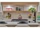 Stylish kitchen featuring updated appliances, open shelving, and quartz countertops at 3109 Siena Cir, Las Vegas, NV 89128