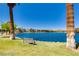 Relaxing lake view featuring seating, trees, and tranquil blue waters at 3109 Siena Cir, Las Vegas, NV 89128