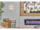 A cozy living room corner features a chair, modern fireplace, and a TV showing the Golden Knights hockey team at 3109 Siena Cir, Las Vegas, NV 89128