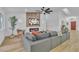 Spacious living room featuring a large sectional sofa, modern fireplace, and seamless flow into other living areas at 3109 Siena Cir, Las Vegas, NV 89128