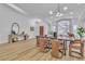 An open concept view of the front door, dining area, and adjacent living room with large windows at 3109 Siena Cir, Las Vegas, NV 89128