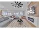 Comfortable living room boasts a large sectional, fireplace, and backyard access at 3109 Siena Cir, Las Vegas, NV 89128
