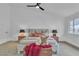 Comfortable bedroom features a vaulted ceiling and stylish bedside tables with lamps at 3109 Siena Cir, Las Vegas, NV 89128