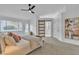 Bright bedroom boasts a ceiling fan and a modern barn door to ensuite at 3109 Siena Cir, Las Vegas, NV 89128