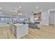 Bright open floor plan with kitchen island overlooking the living room and fireplace at 3109 Siena Cir, Las Vegas, NV 89128