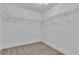 Spacious walk-in closet with ample shelving and carpet flooring at 3109 Siena Cir, Las Vegas, NV 89128