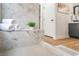 Bathroom featuring a marble shower bench, wood floors, and access to a closet at 3436 Camsore Point Ln, Las Vegas, NV 89129