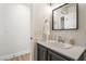 Charming bathroom features a modern vanity with a sleek, black-framed mirror at 3436 Camsore Point Ln, Las Vegas, NV 89129