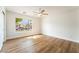 An empty bedroom space with wood floors and natural light at 3436 Camsore Point Ln, Las Vegas, NV 89129