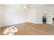 Spacious bedroom with beautiful wood-look floors and lots of natural light entering the space at 3436 Camsore Point Ln, Las Vegas, NV 89129