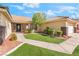 Attractive home featuring a well-kept lawn, mature landscaping, and a two-car garage at 3436 Camsore Point Ln, Las Vegas, NV 89129