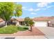 Charming single-story home with a manicured front lawn and a two car garage at 3436 Camsore Point Ln, Las Vegas, NV 89129