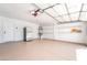 Garage features lots of space, shelving and a refrigerator at 3436 Camsore Point Ln, Las Vegas, NV 89129