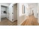 Bright hallway with access to a laundry room and multiple rooms at 3436 Camsore Point Ln, Las Vegas, NV 89129
