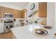 Bright kitchen features stainless steel appliances and a breakfast bar at 3436 Camsore Point Ln, Las Vegas, NV 89129