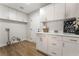 Laundry area with white cabinetry and countertops, perfect for organization at 3436 Camsore Point Ln, Las Vegas, NV 89129