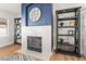 A cozy living room with a fireplace and built-in shelves at 3436 Camsore Point Ln, Las Vegas, NV 89129