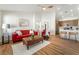 Open living room with wood flooring and decor leading into a modern kitchen at 3436 Camsore Point Ln, Las Vegas, NV 89129