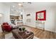 Open living room leading into a kitchen with stainless steel appliances and breakfast bar at 3436 Camsore Point Ln, Las Vegas, NV 89129