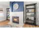 A cozy living room with a fireplace and built-in shelves at 3436 Camsore Point Ln, Las Vegas, NV 89129