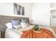 Main bedroom featuring a well-appointed bed with stylish decor and modern art at 3436 Camsore Point Ln, Las Vegas, NV 89129