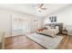 Spacious main bedroom features a ceiling fan, shutters, and bright, natural light at 3436 Camsore Point Ln, Las Vegas, NV 89129
